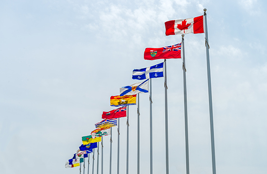 row of different Canada flags